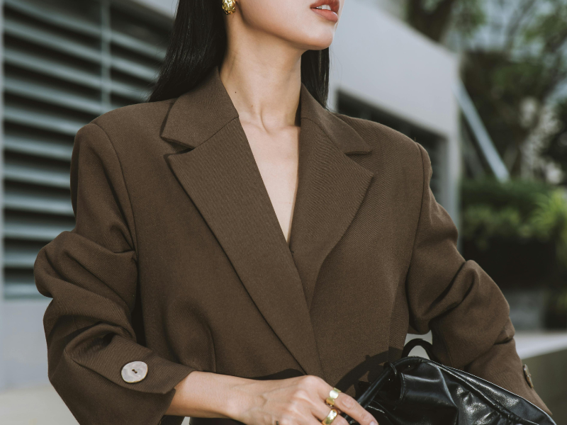 woman wearing brown blazer